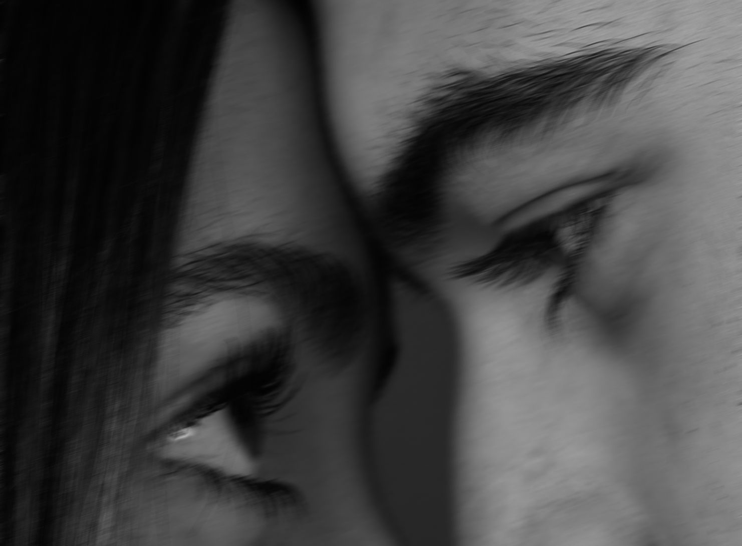 Two people looking at each other very closely - black and white photograph