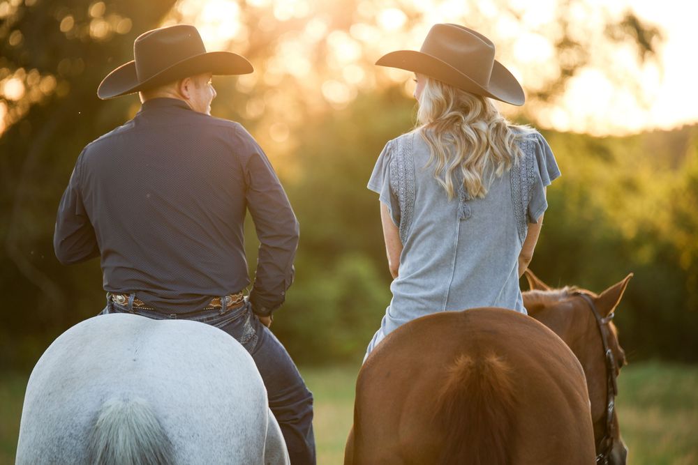 western couple on horseback riding away