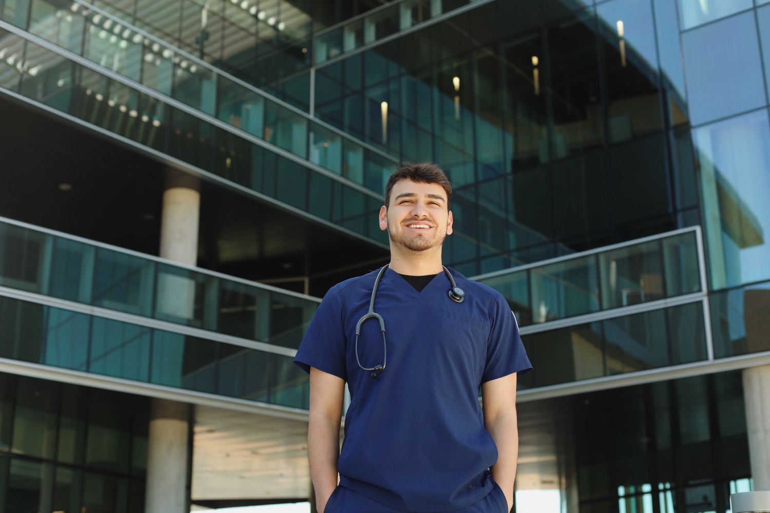 Male student behind a building.