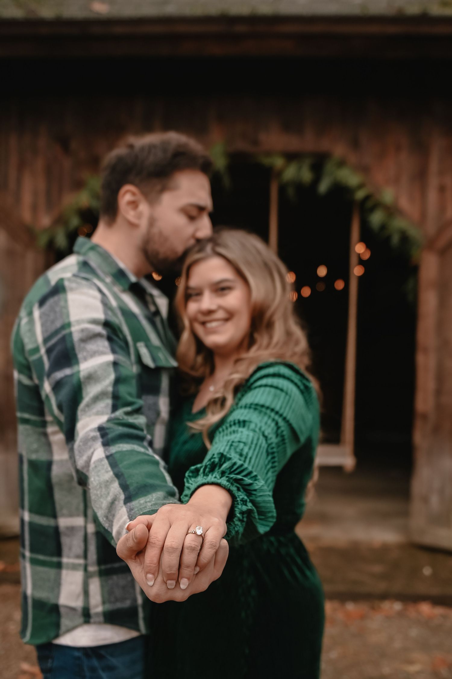 Worcester engagement photographer featuring a couple holding hands outside.