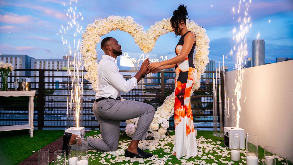 Romantic rooftop proposal captured by top Palm Beach proposal photographers at sunset