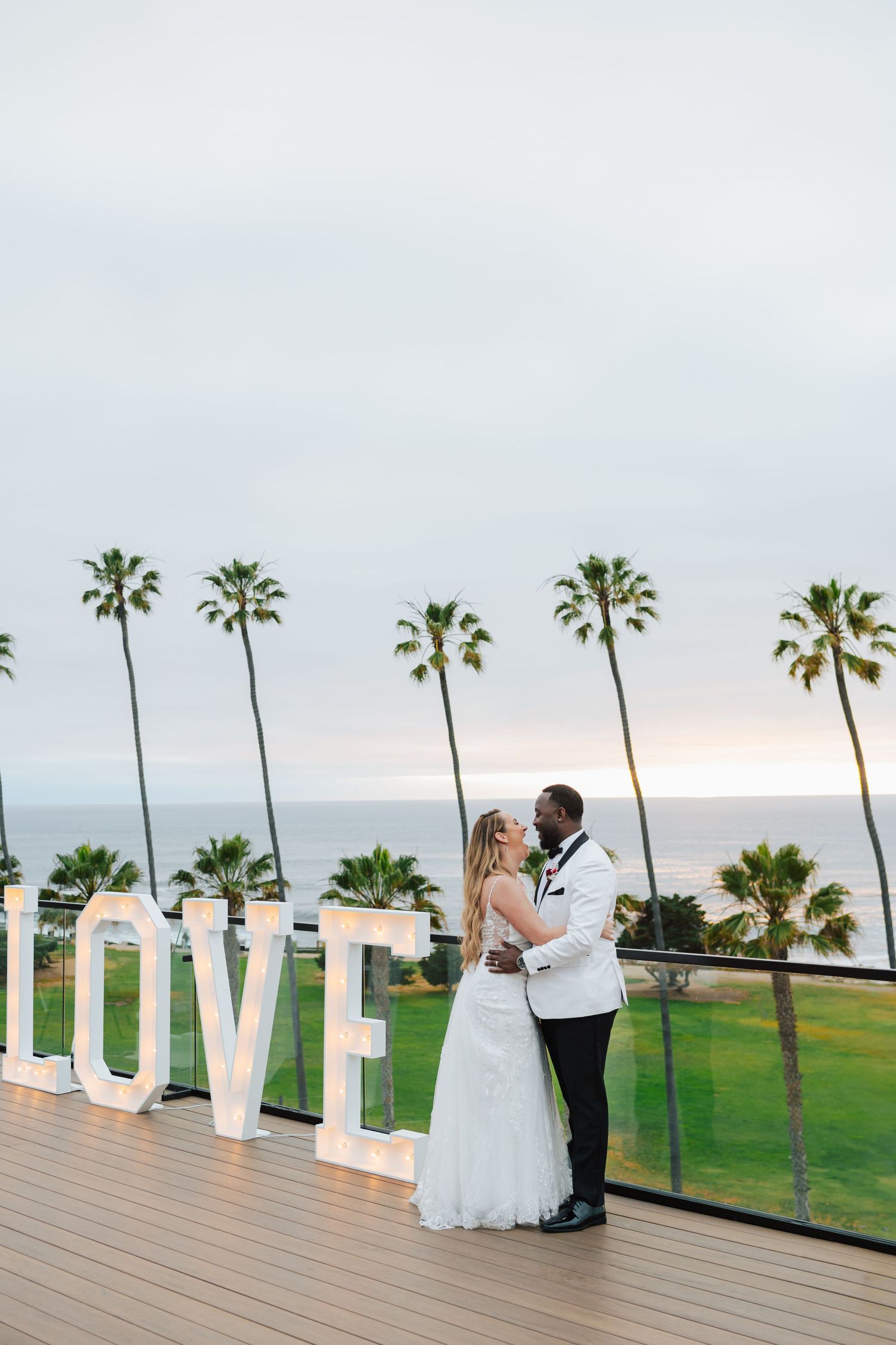Bride and groom portraits overlooking the ocean in La Jolla destination wedding.