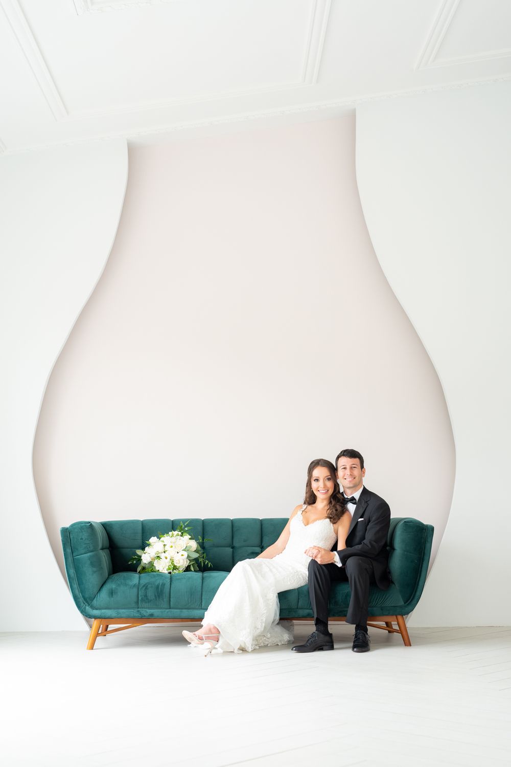 Wedding portrait session of a couple in a bright white Toronto studio.