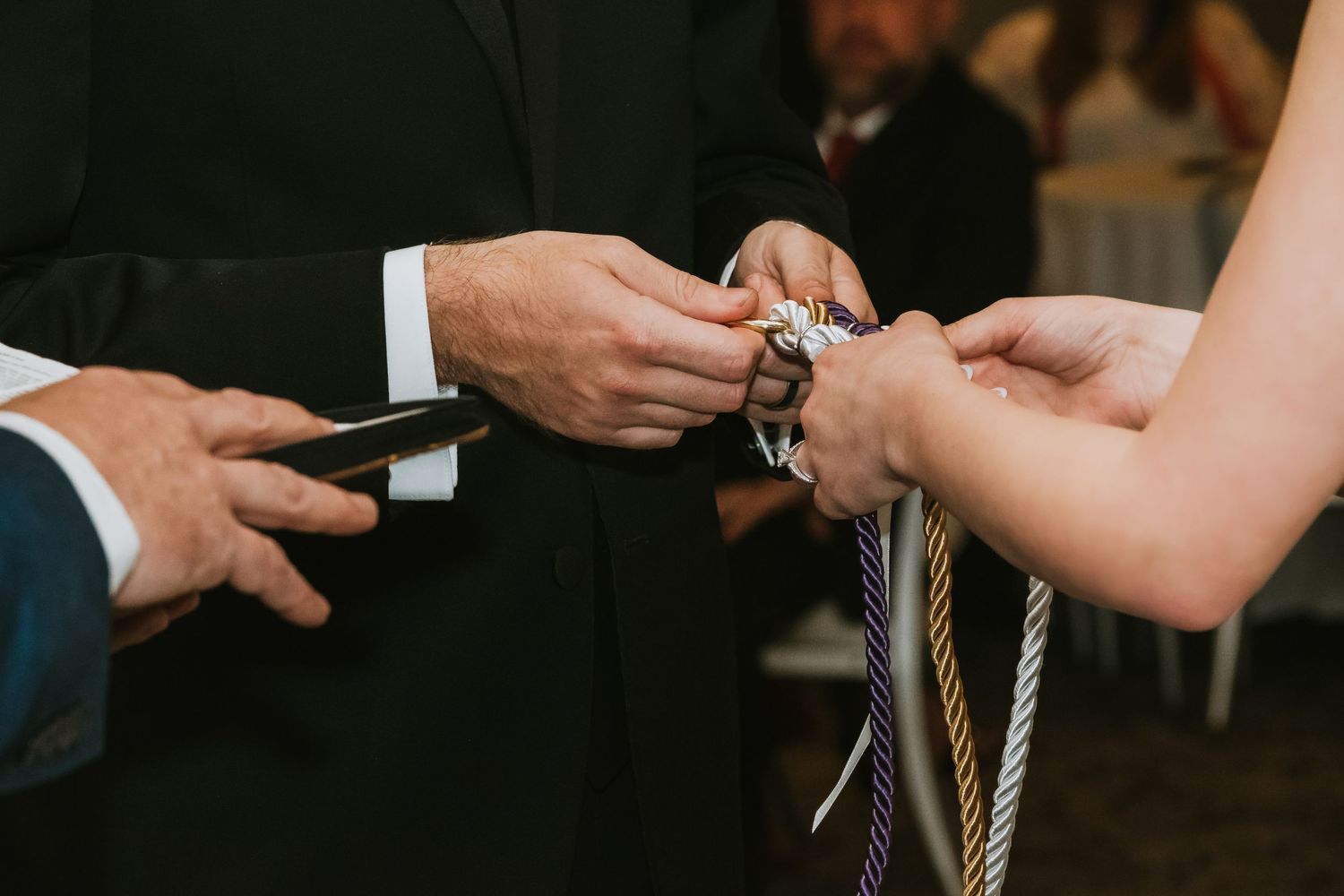 couple exchanging rings Lafayette wedding venue