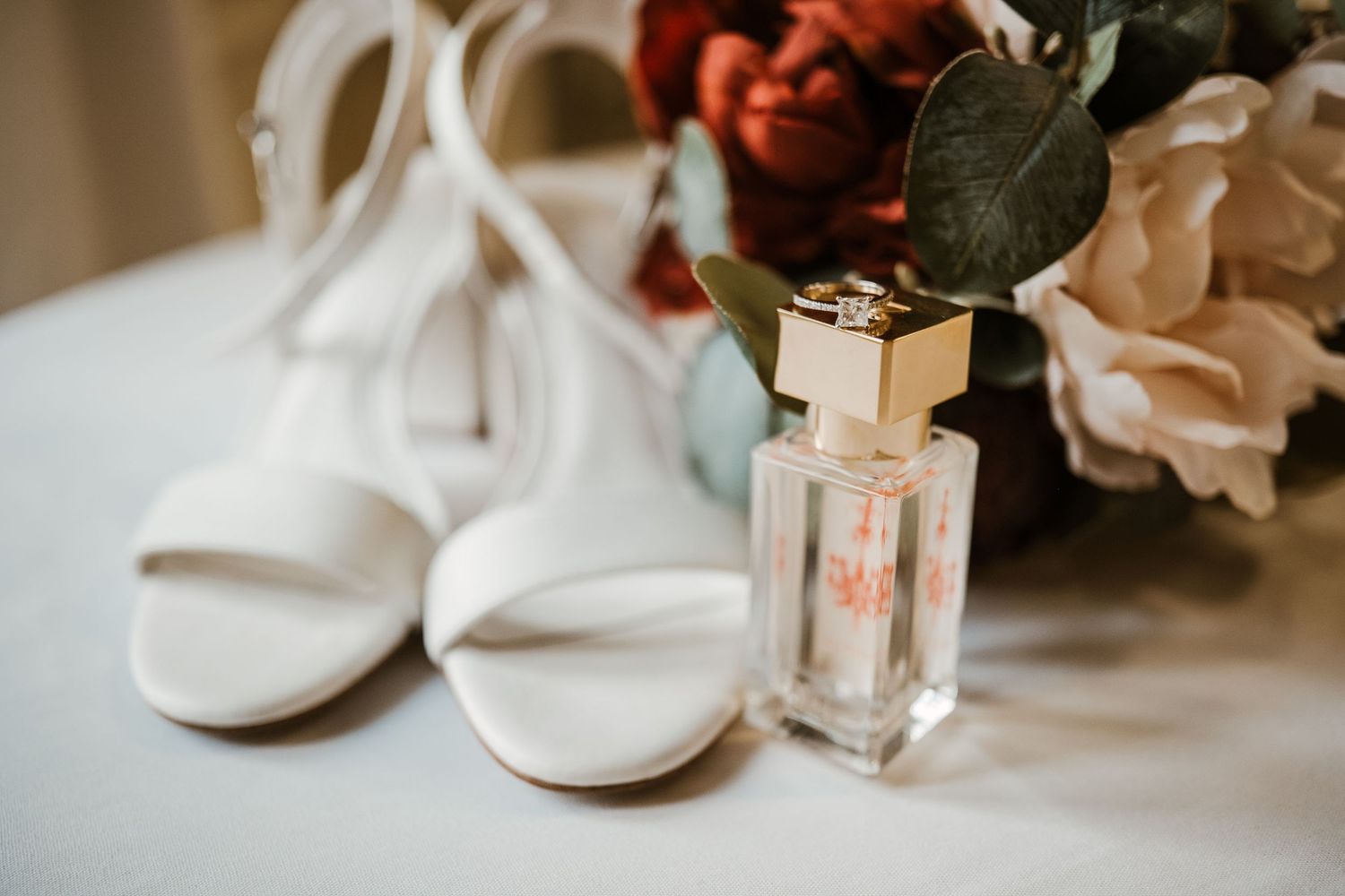 Bridal shoes and perfume with ring Lafayette wedding venue