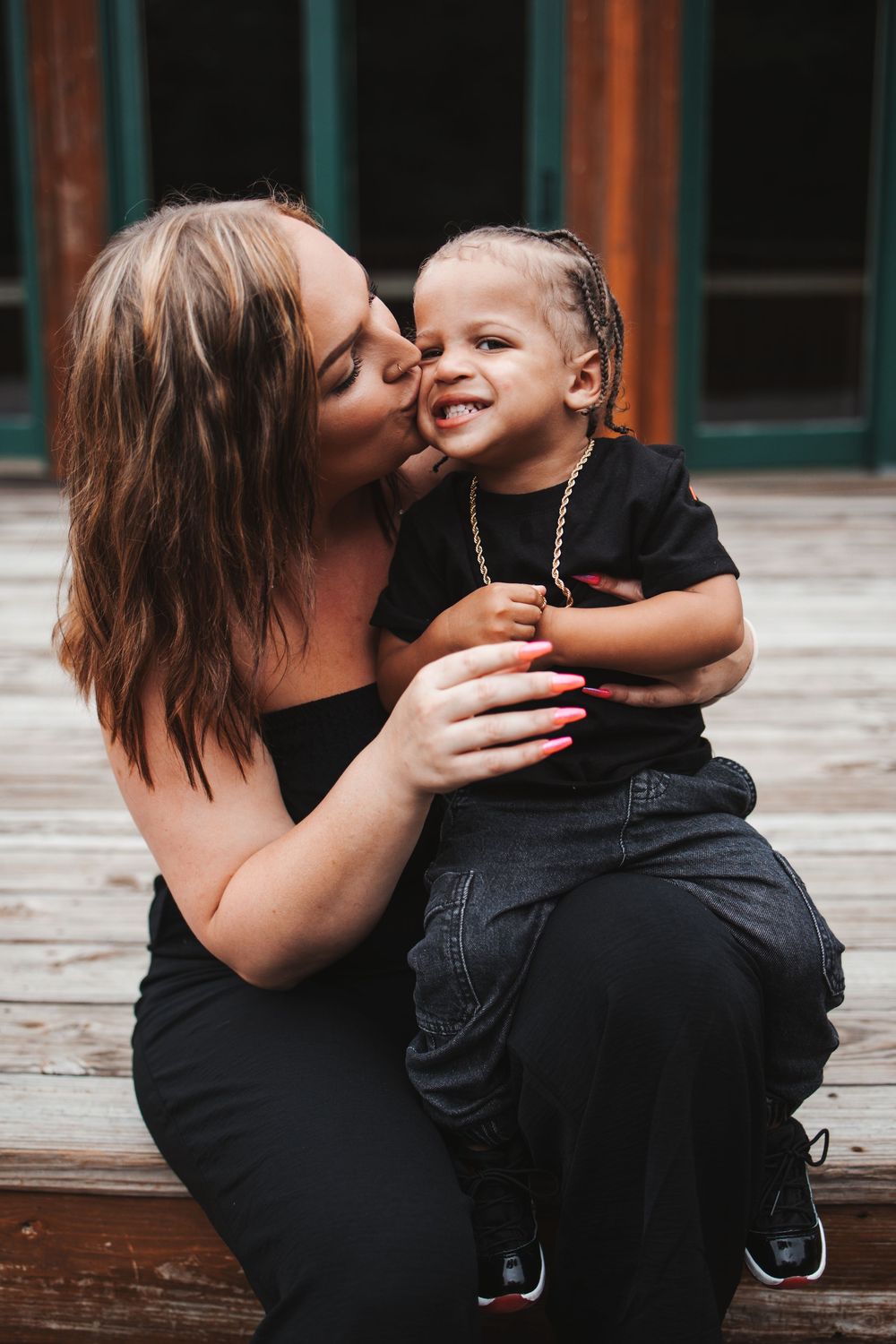 A series of candid shots showing loving moments between parent and child on a wooden deck.