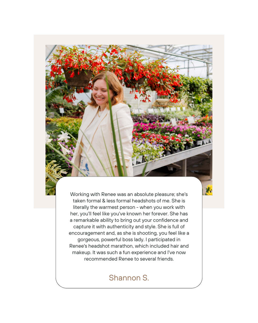 A bright greenhouse interior with vibrant hanging baskets featuring red and pink flowers on metal display shelves.