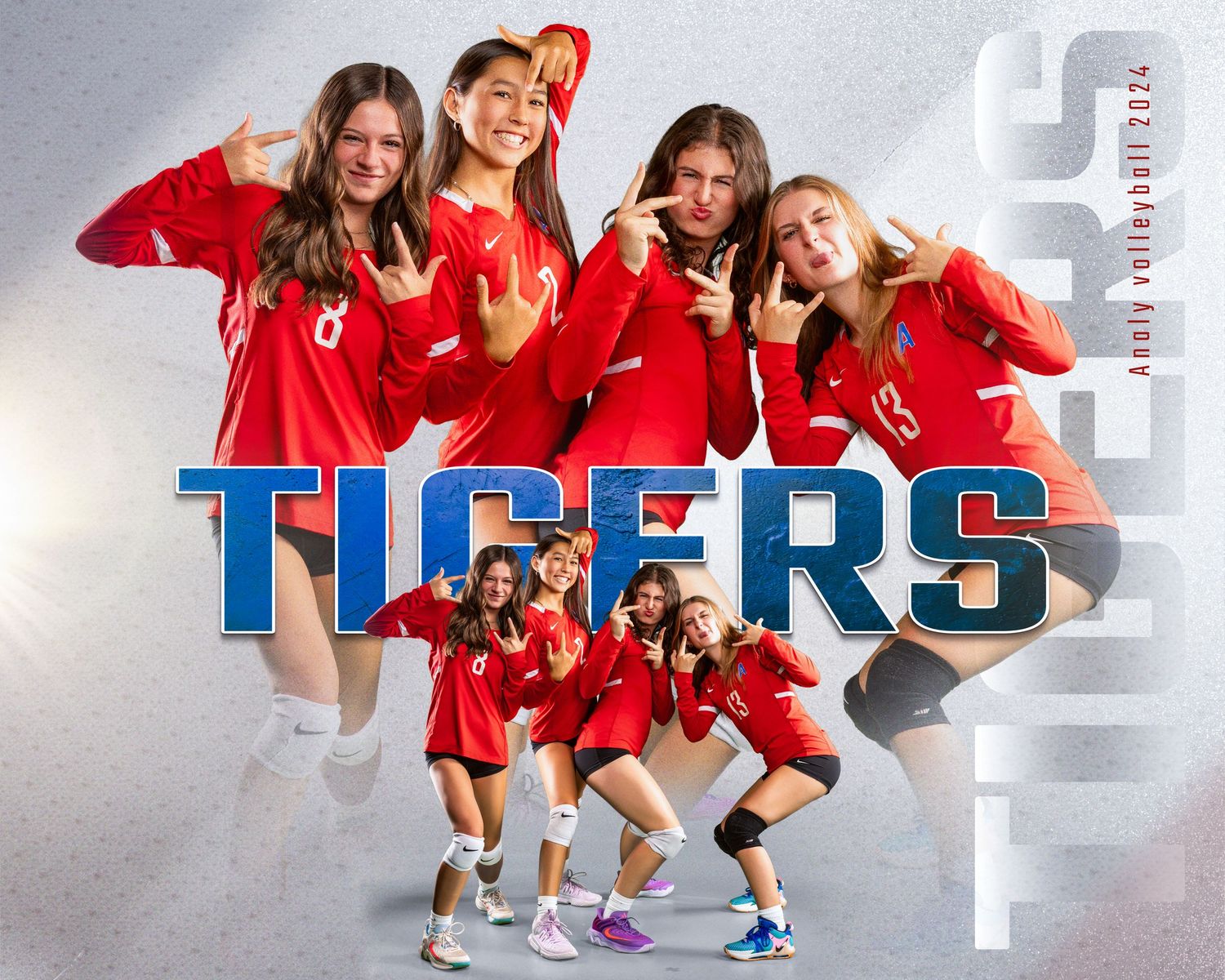 Team photo of Tigers sports players posing playfully in red uniforms.