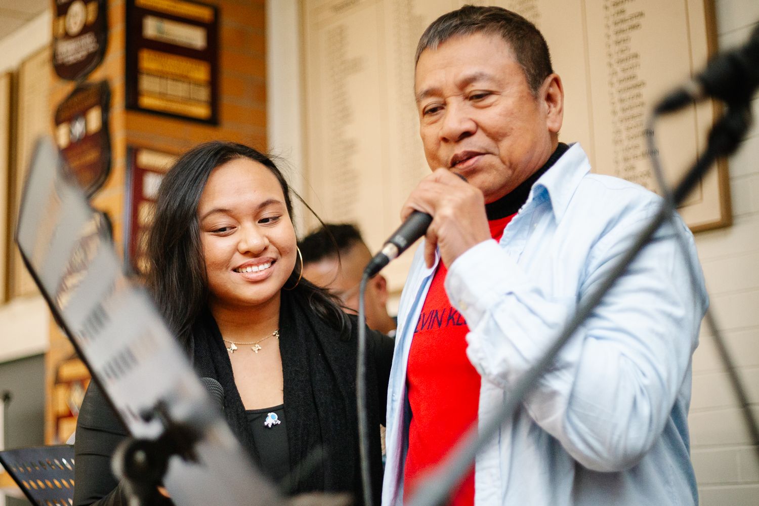 a moment between a father and daughter singing