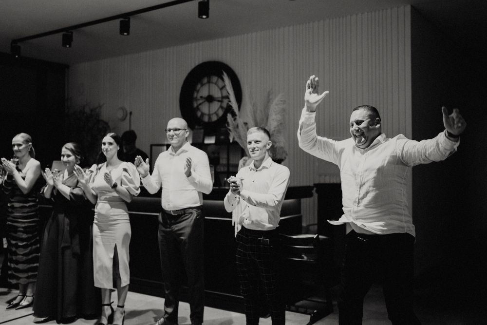 A sequence of celebratory moments captured in black and white at an indoor event.