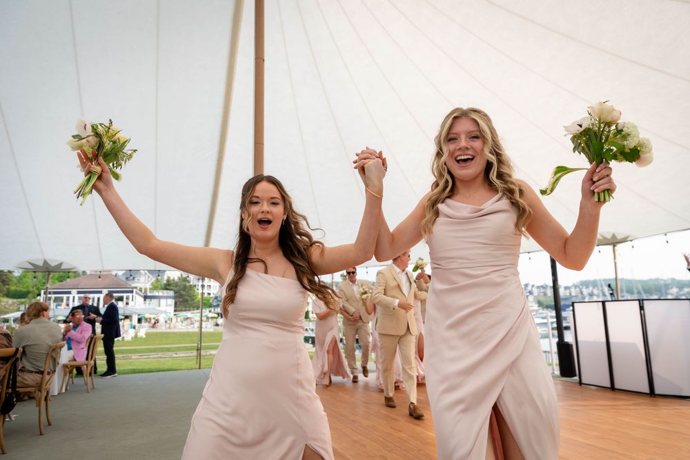A series of joyful moments captured at an elegant outdoor wedding celebration under a white tent by the water.