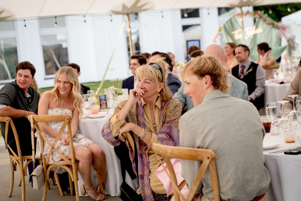 A sequence of wedding reception photos showing guests dining and socializing at tables under a white tent.