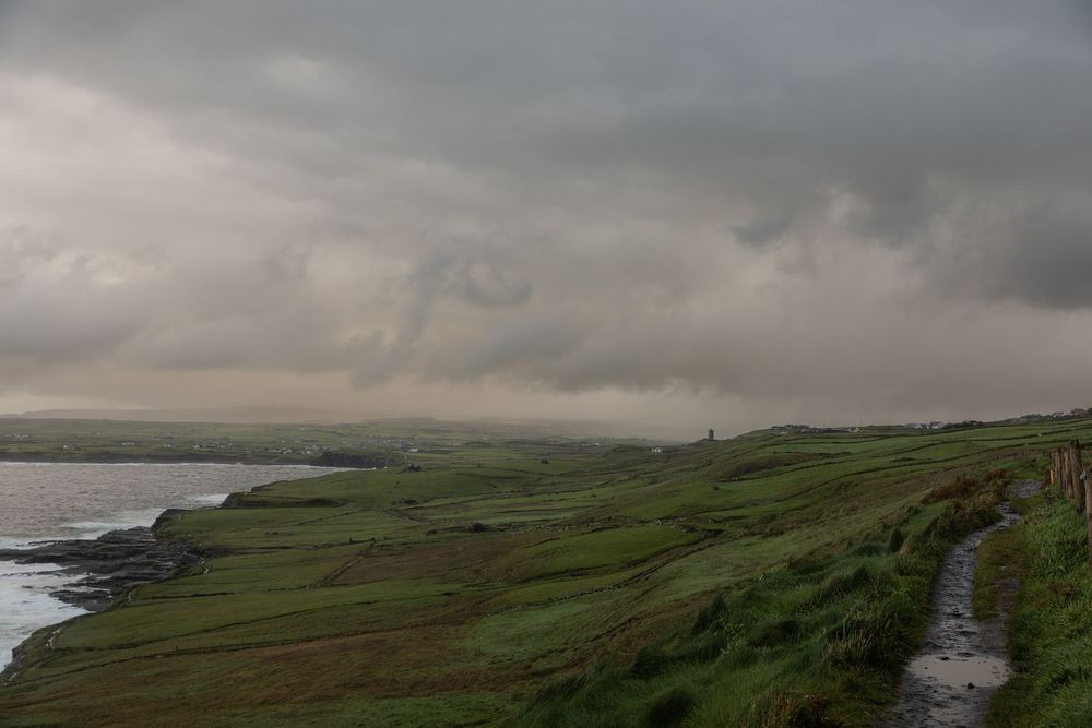 Dramatic sunrise clouds above the Cliffs of Moher coastal landscape