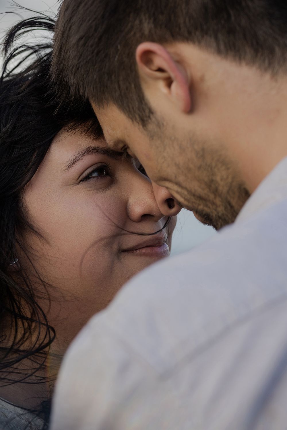 Couple having an intimate moment during sunrise elopement at Cliffs of Moher