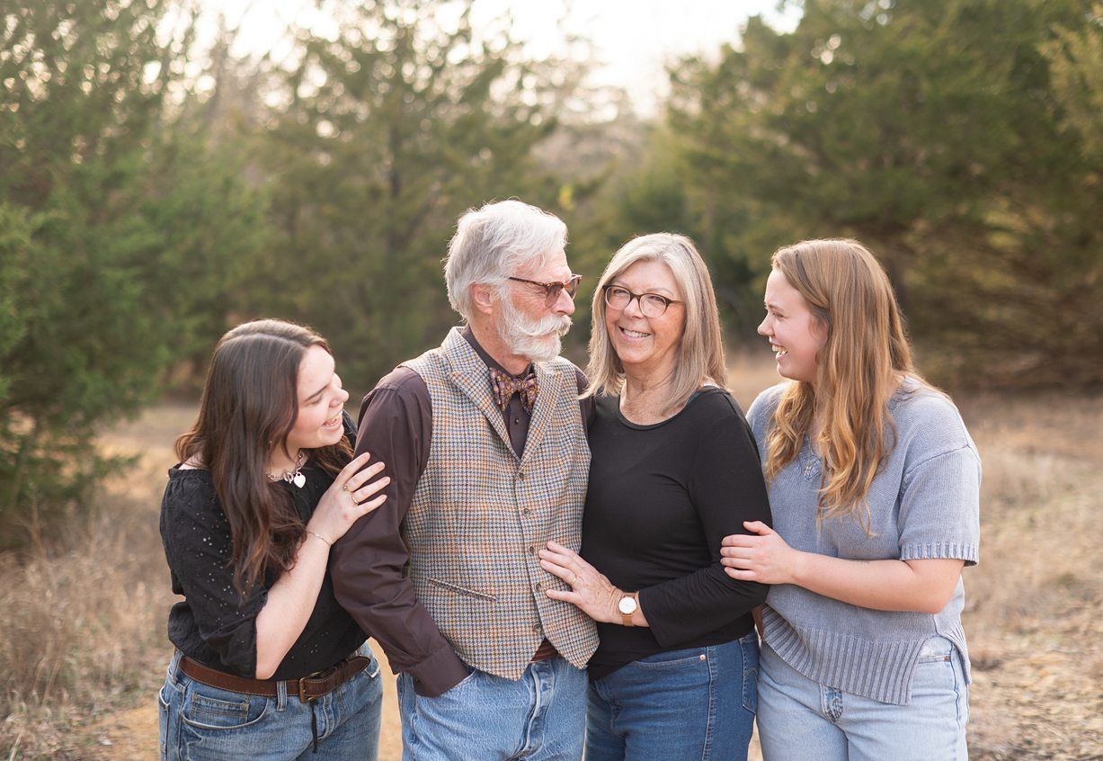 Small Extended Family Session in Winter Field of Evergreens by Bartlesville Family Photographer Kristi Bray