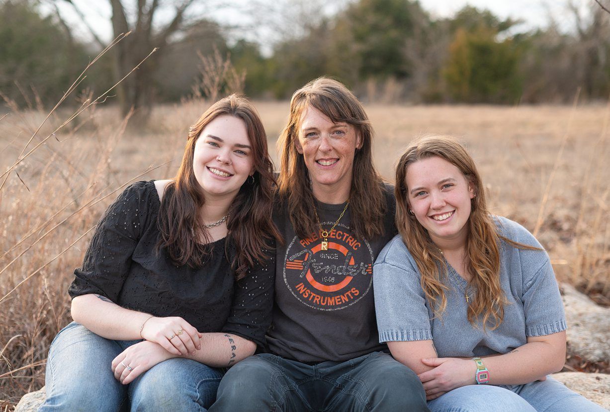 Small Extended Family Session in Winter Field of Evergreens by Bartlesville Family Photographer Kristi Bray