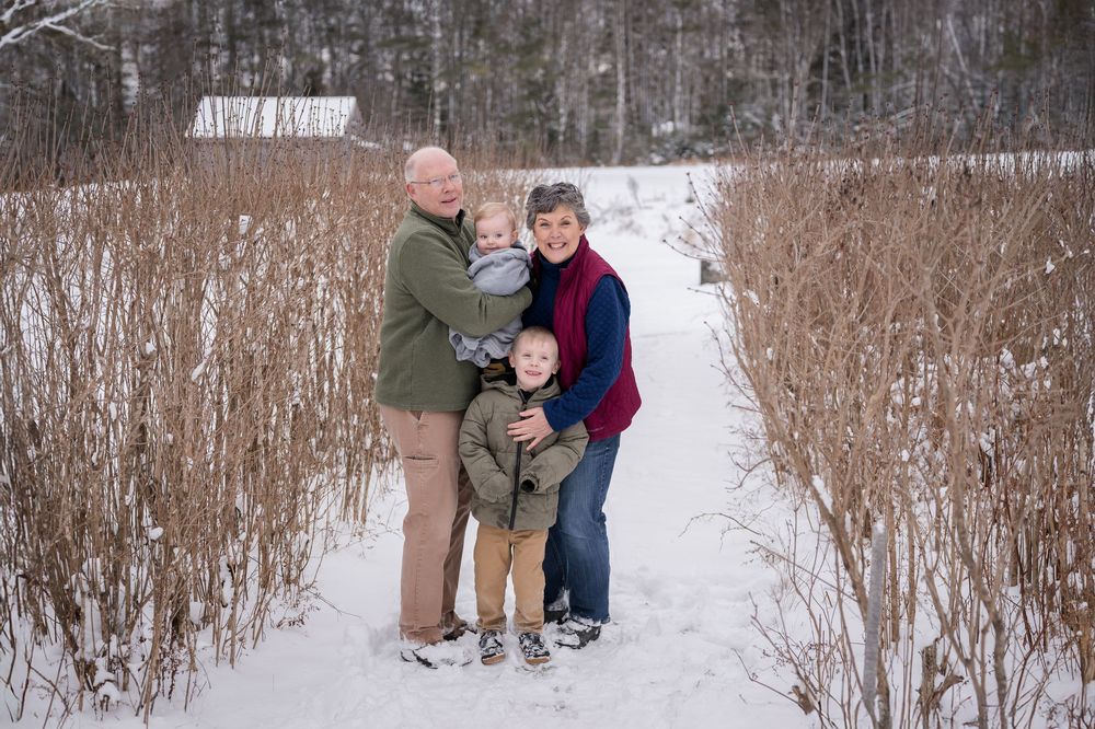 A playful winter family photoshoot sequence showing joyful interactions in the snow.