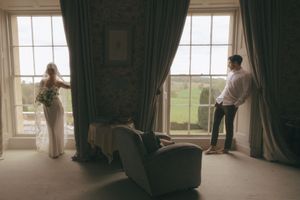 A series of window views show people looking outside through large paned windows with curtains.