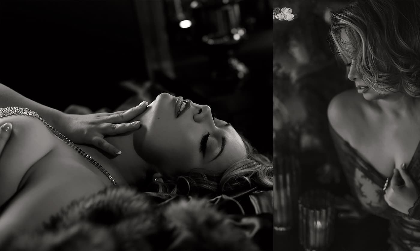 A dramatic black and white film noir scene shows two figures in an intimate embrace against a dark background.