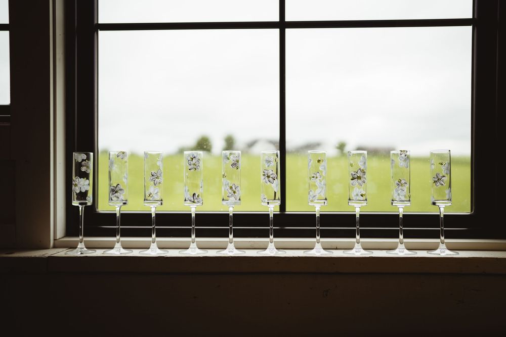 Row of cute animal stickers or decals visible through a window frame with dark framing.