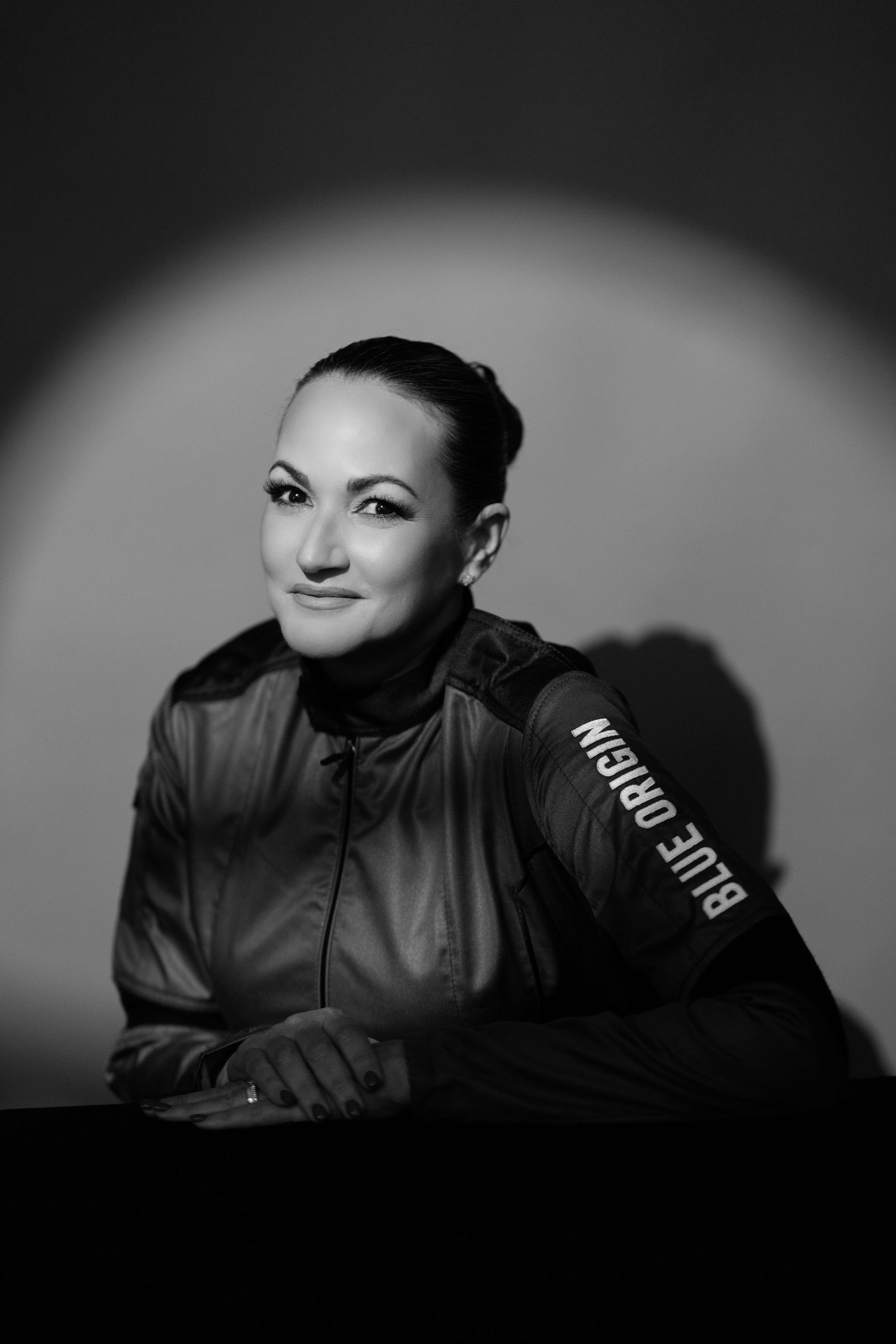 A dramatic black and white portrait sequence showing a person in shadows with lighting gradually shifting across the frames.