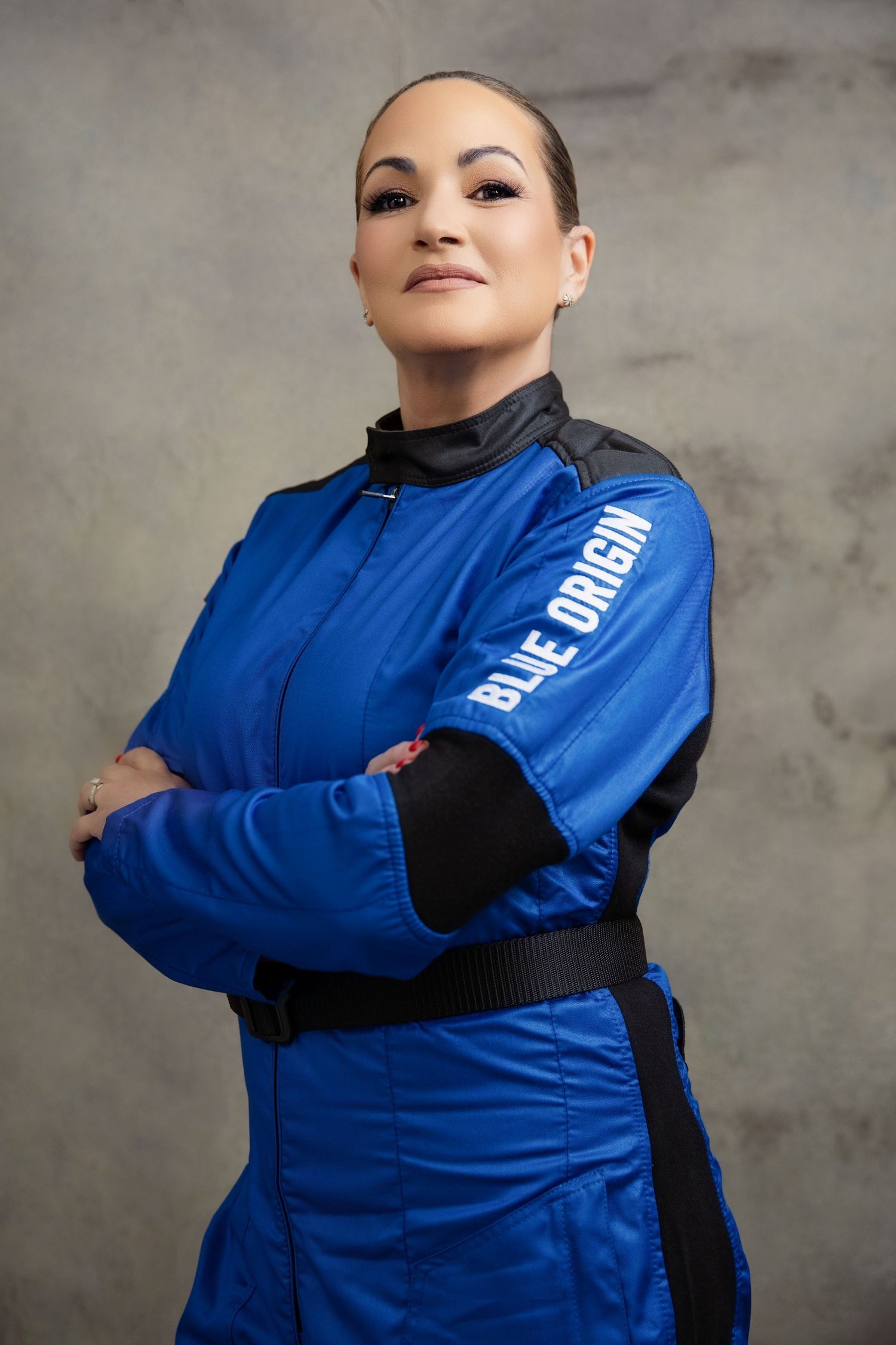 Professional model demonstrates blue athletic jacket with black contrast panels from multiple angles.