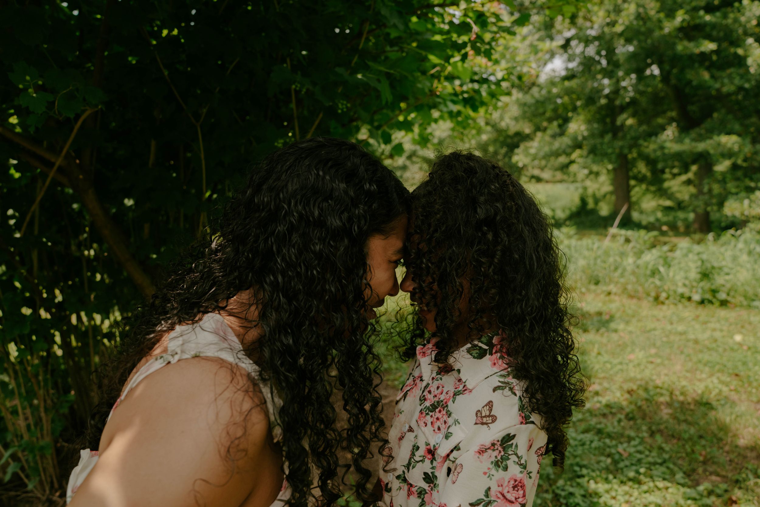A series of intimate portraits showing close connections in a natural outdoor setting.