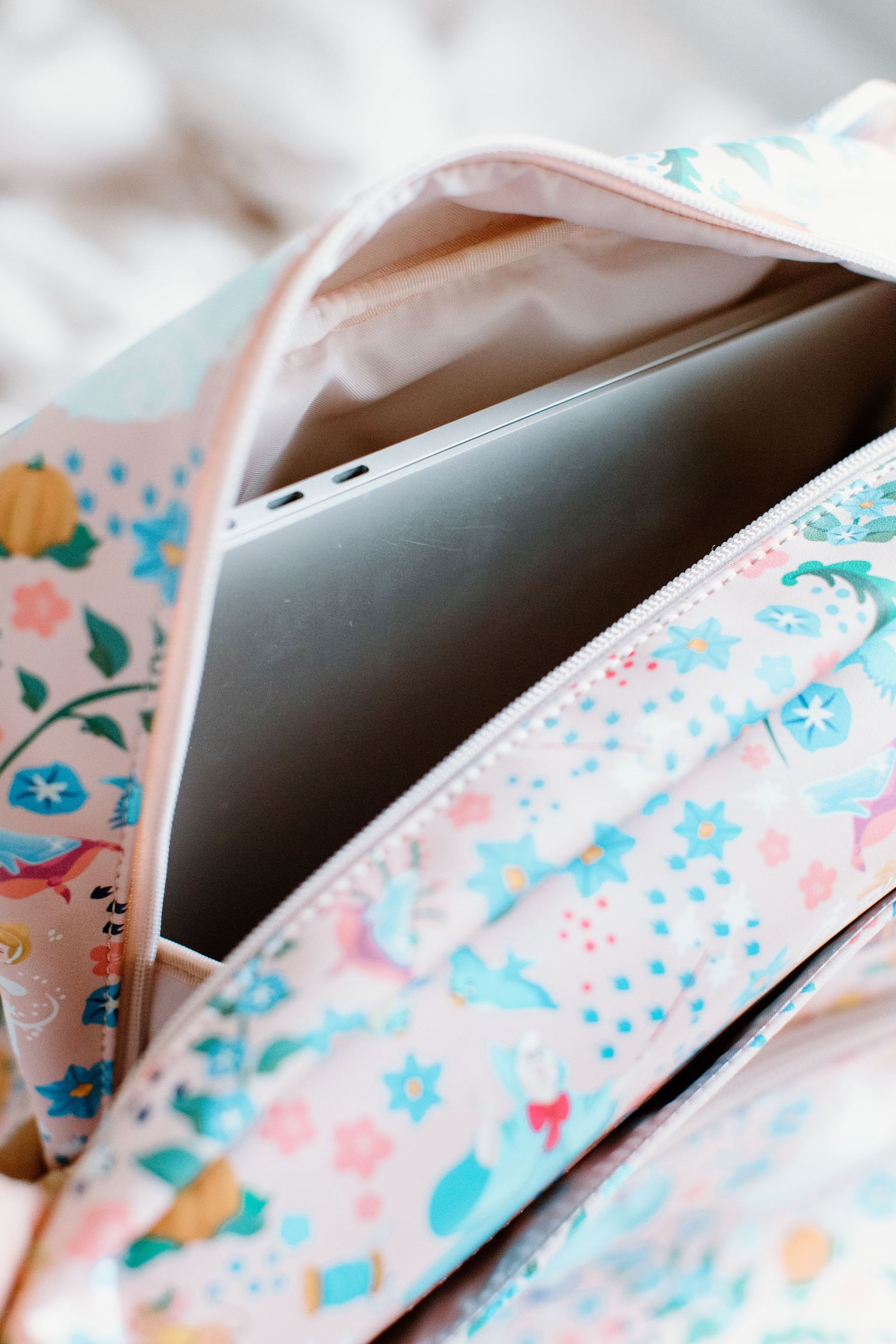 Close-up of pink and turquoise floral fabric pattern.