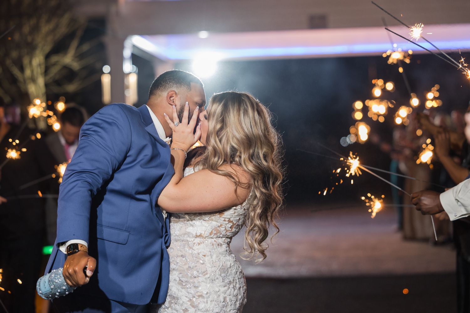 Romantic evening celebration with sparklers and twinkling lights.