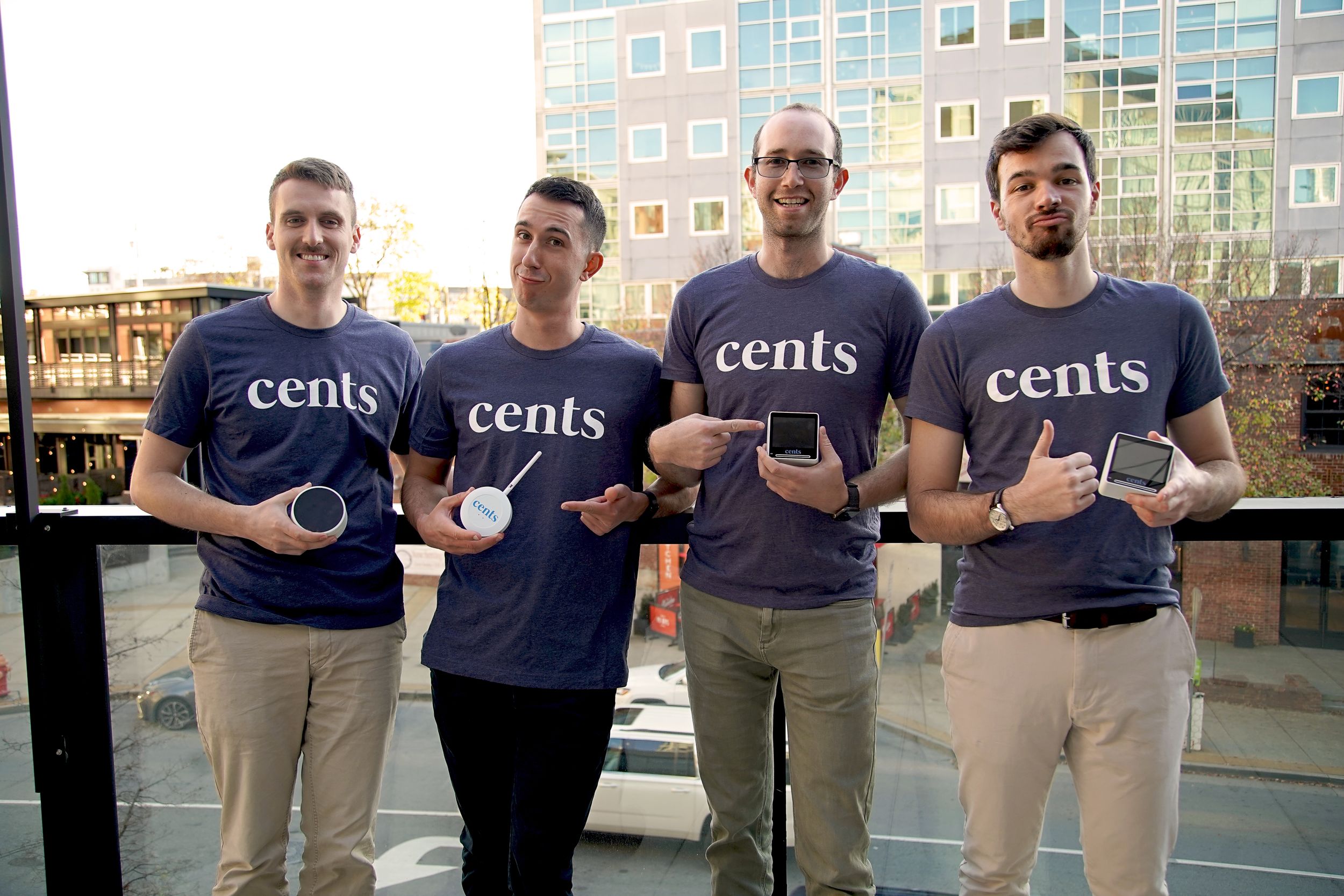 Team members wearing matching Cents t-shirts posing together in a group photo.