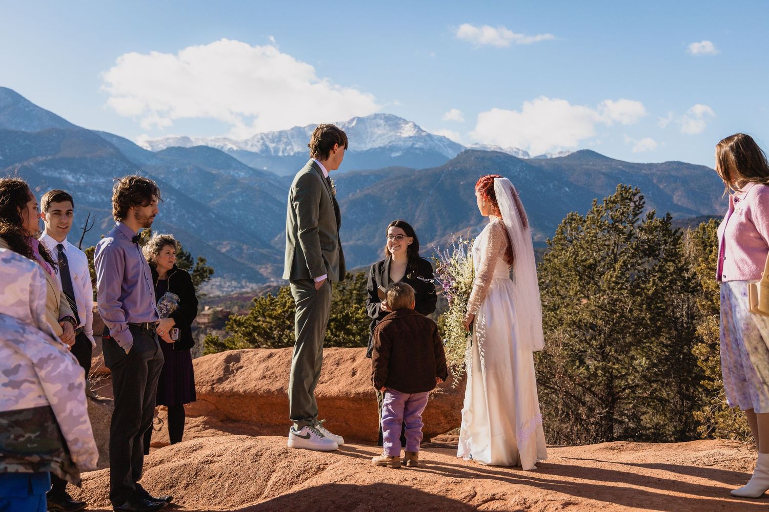 A wedding ceremony with spectacular mountain views in a desert landscape at Garden of the Gods in Colorado Springs.