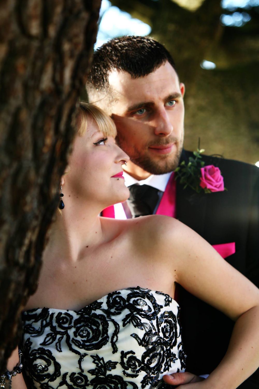 Romantic wedding portrait series featuring couple in formal attire among pine trees.