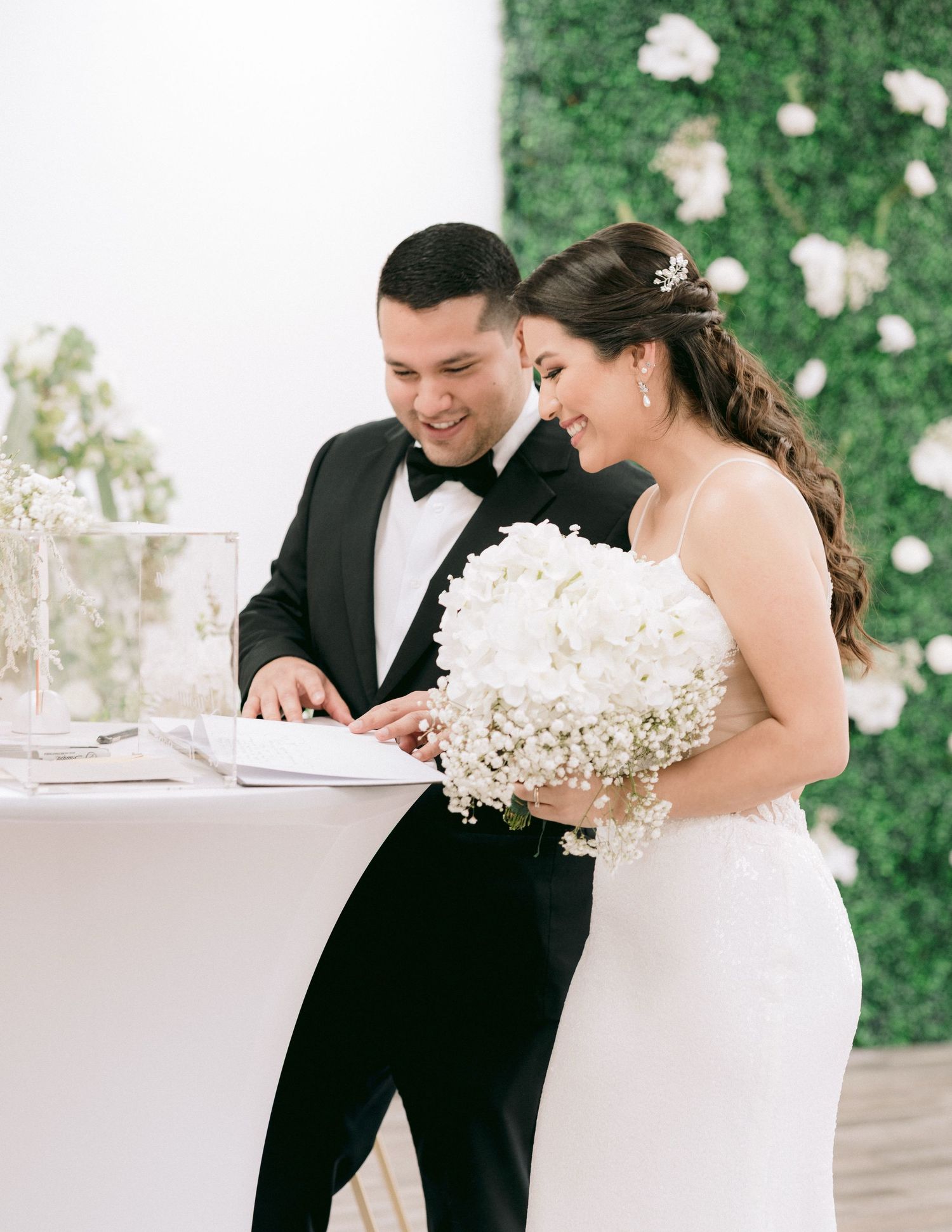 Close-up of the groom with custom sneakers that read “FOREVER” in focus.