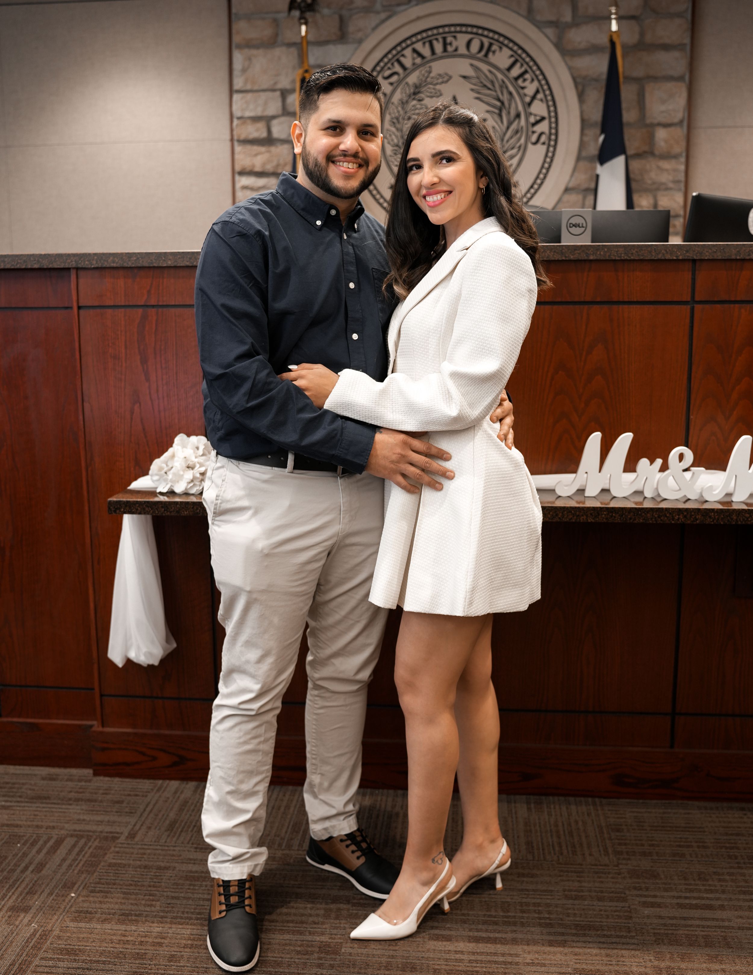 Couple standing together after their courthouse wedding, smiling and celebrating their union.
