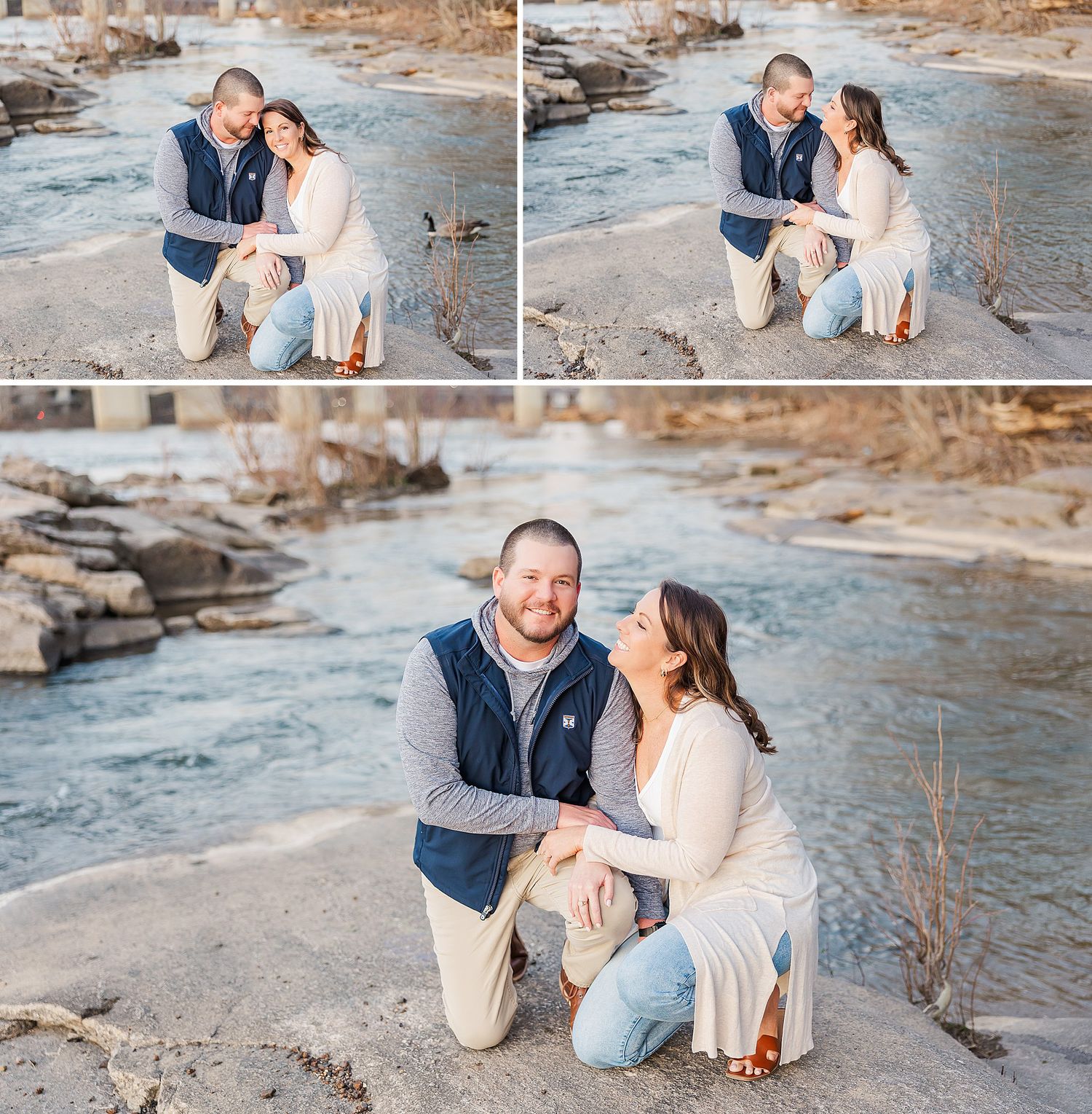 Couple in casual attire sharing tender moments while sitting by a rocky riverbank in autumn scenery.