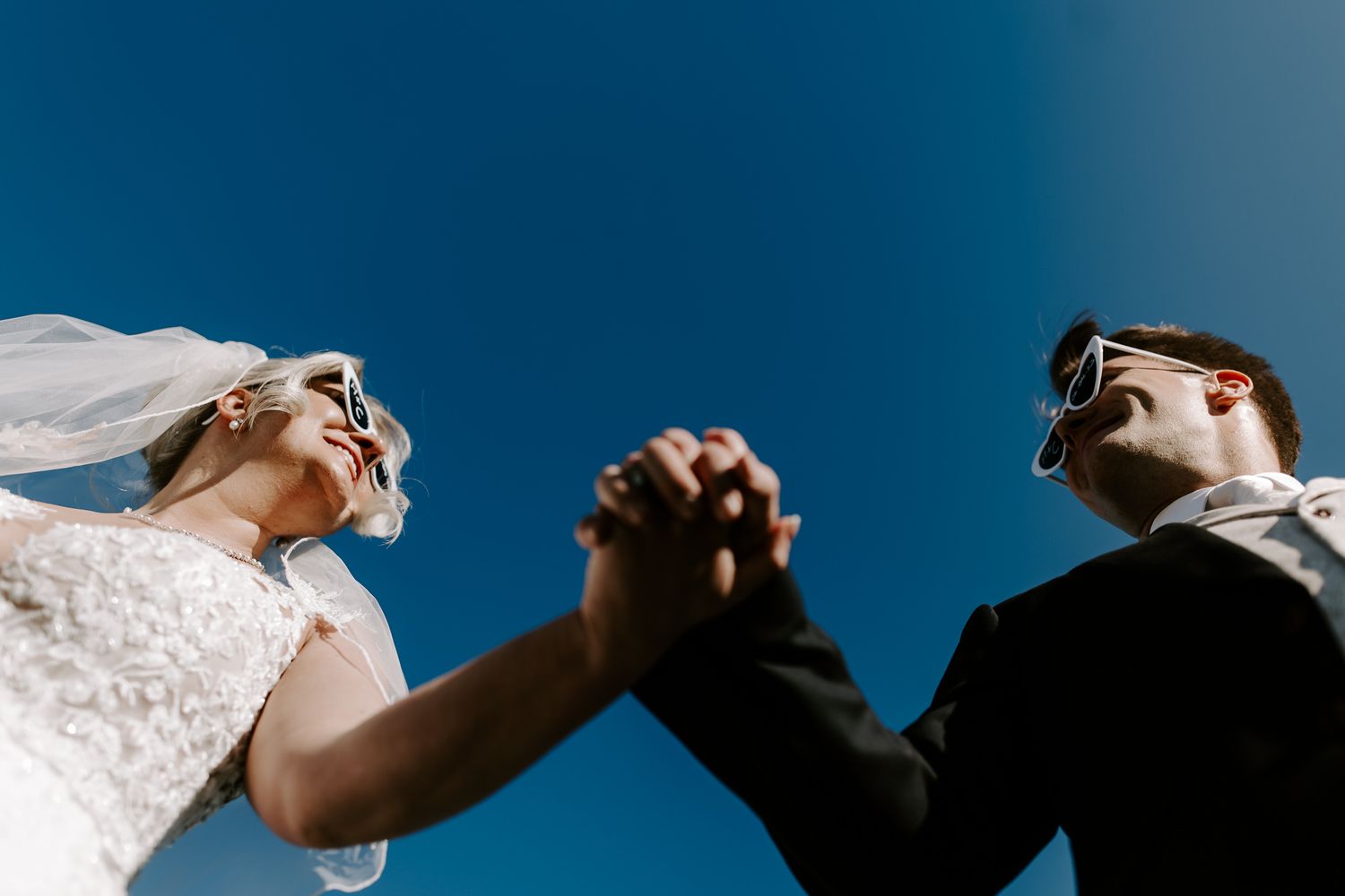 Low angle of wedding couple