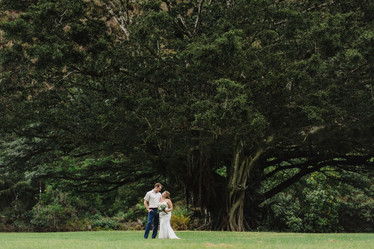 A wedding couple portrait session at Waimea valley Oahu Hawaii