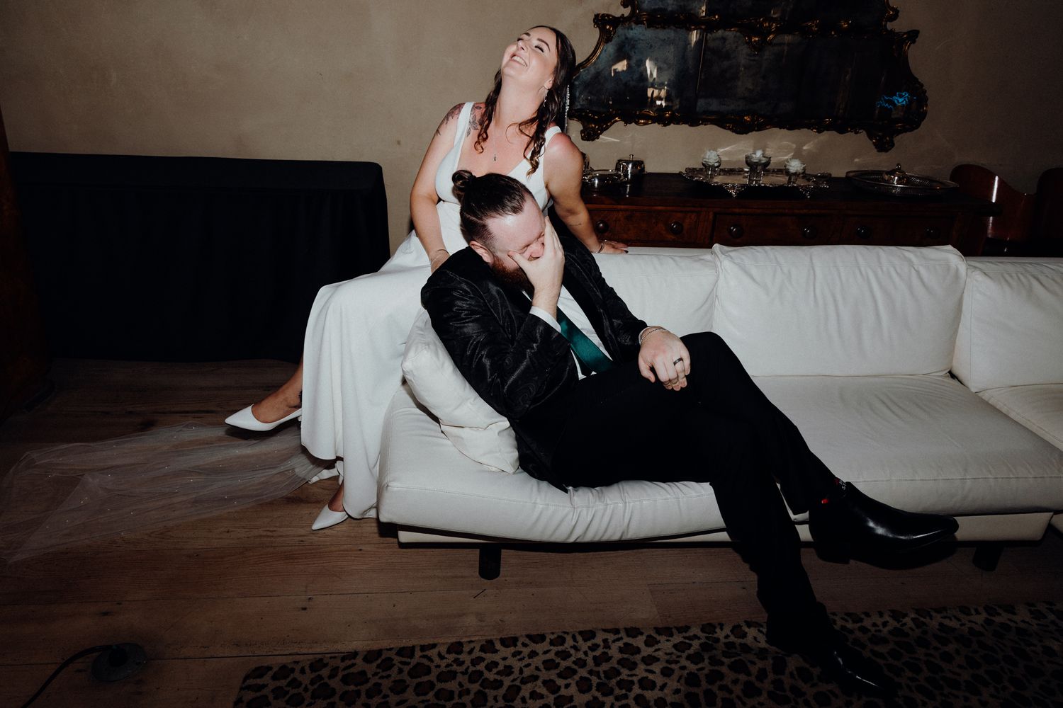 The bride and groom laughs during their portrait session, captured by Apertured Media Auckland Wedding Photographer.