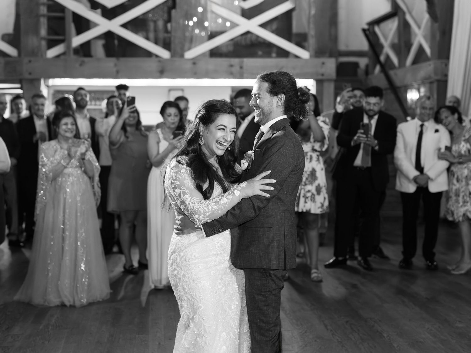 Moment of bride and groom during their first dance laughing at Earth to Table Farm capture by Katie Crane