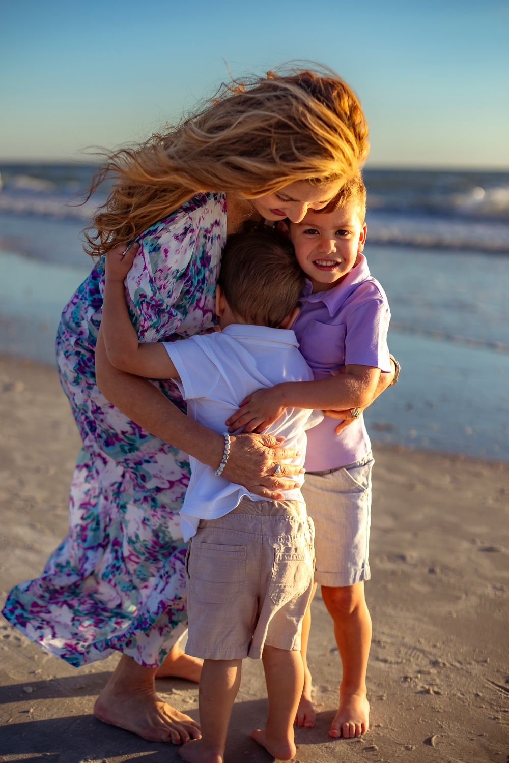 grandmother with grandchildren on st. pete beach family photographer