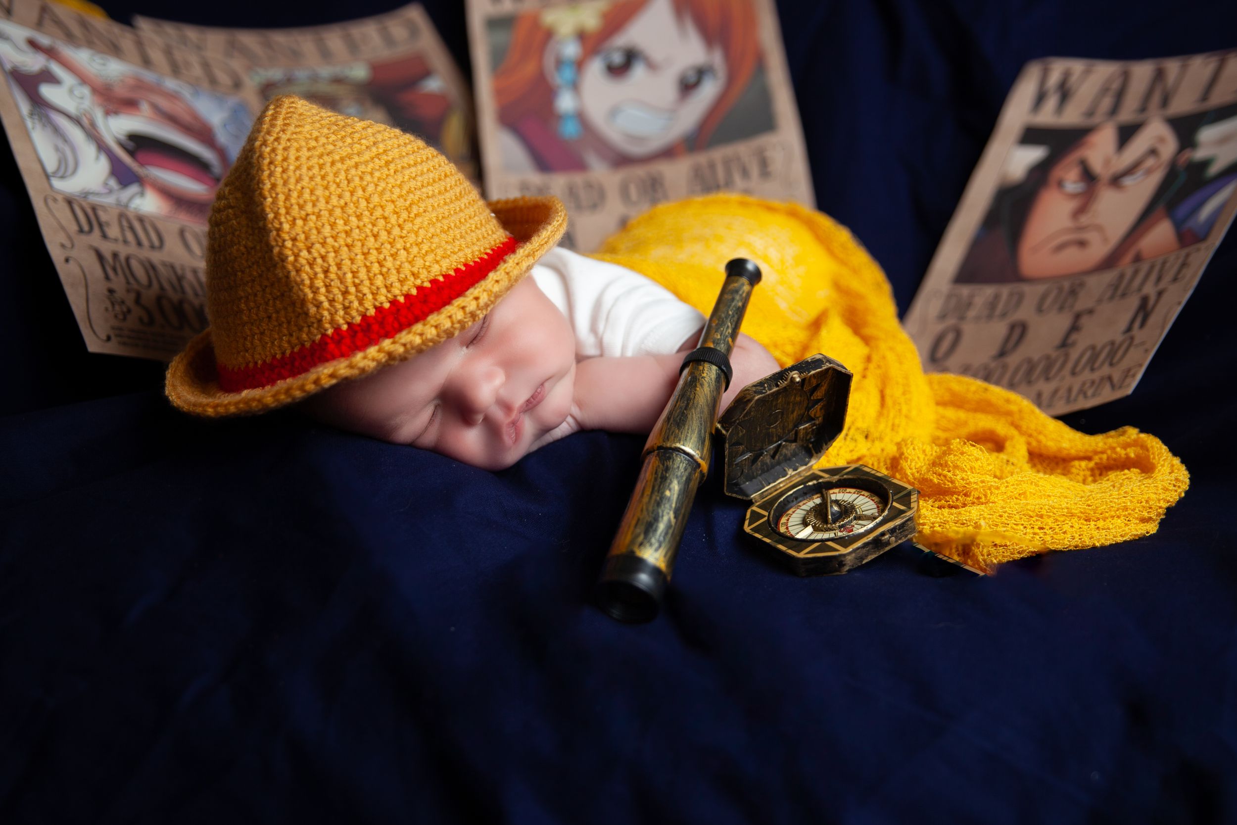 Trumpet player wearing a yellow knit hat performing music in dim lighting.