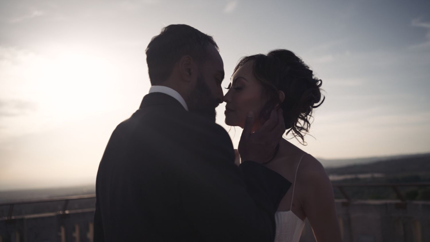 Bride & Groom face each other at the dusk