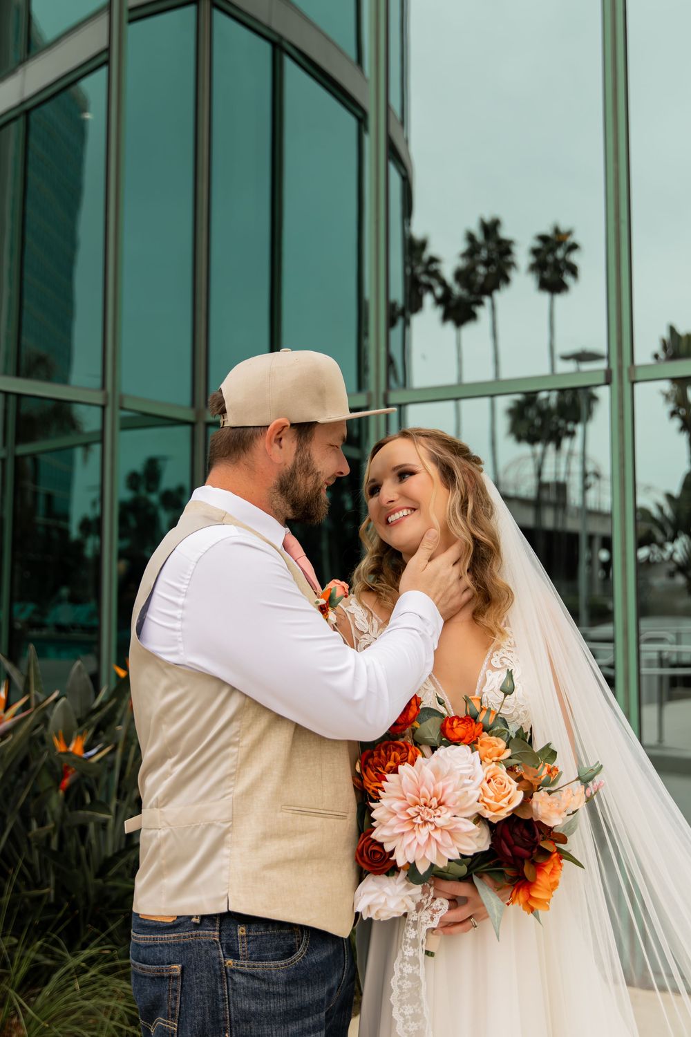 A romantic wedding photo collage showing tender moments between newlyweds against a modern glass building exterior.