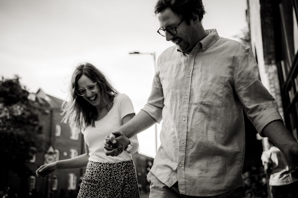 Close up, black and white photo of couple smiling
