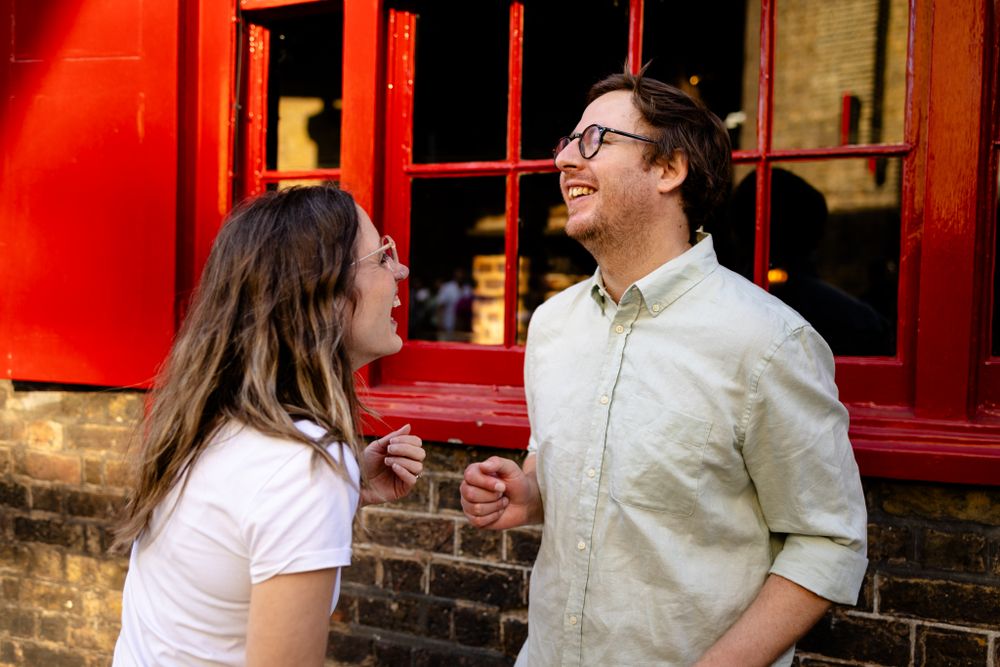 Couple outside London pub for wedding photos