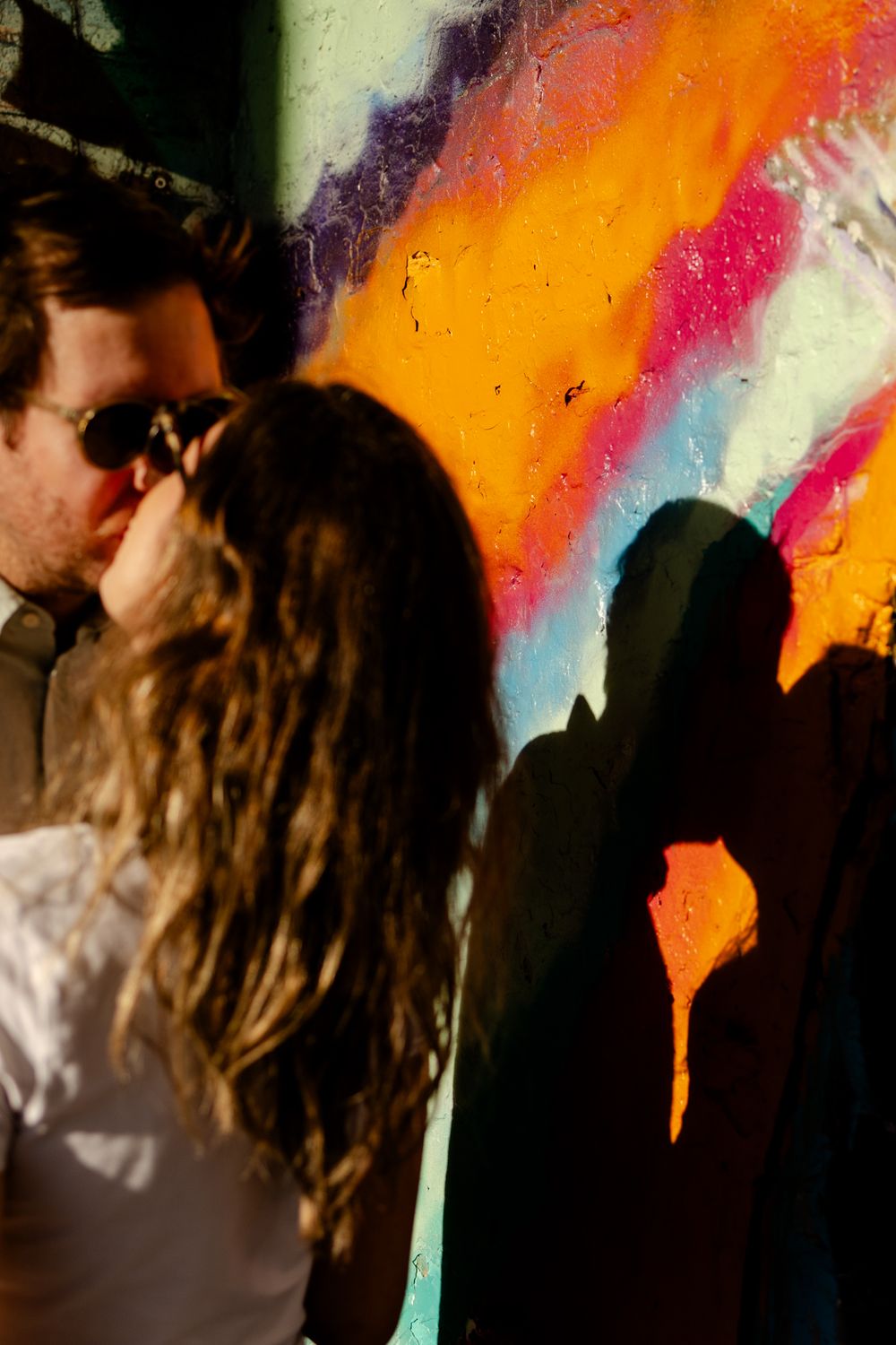 Couple kissing for practice wedding photos