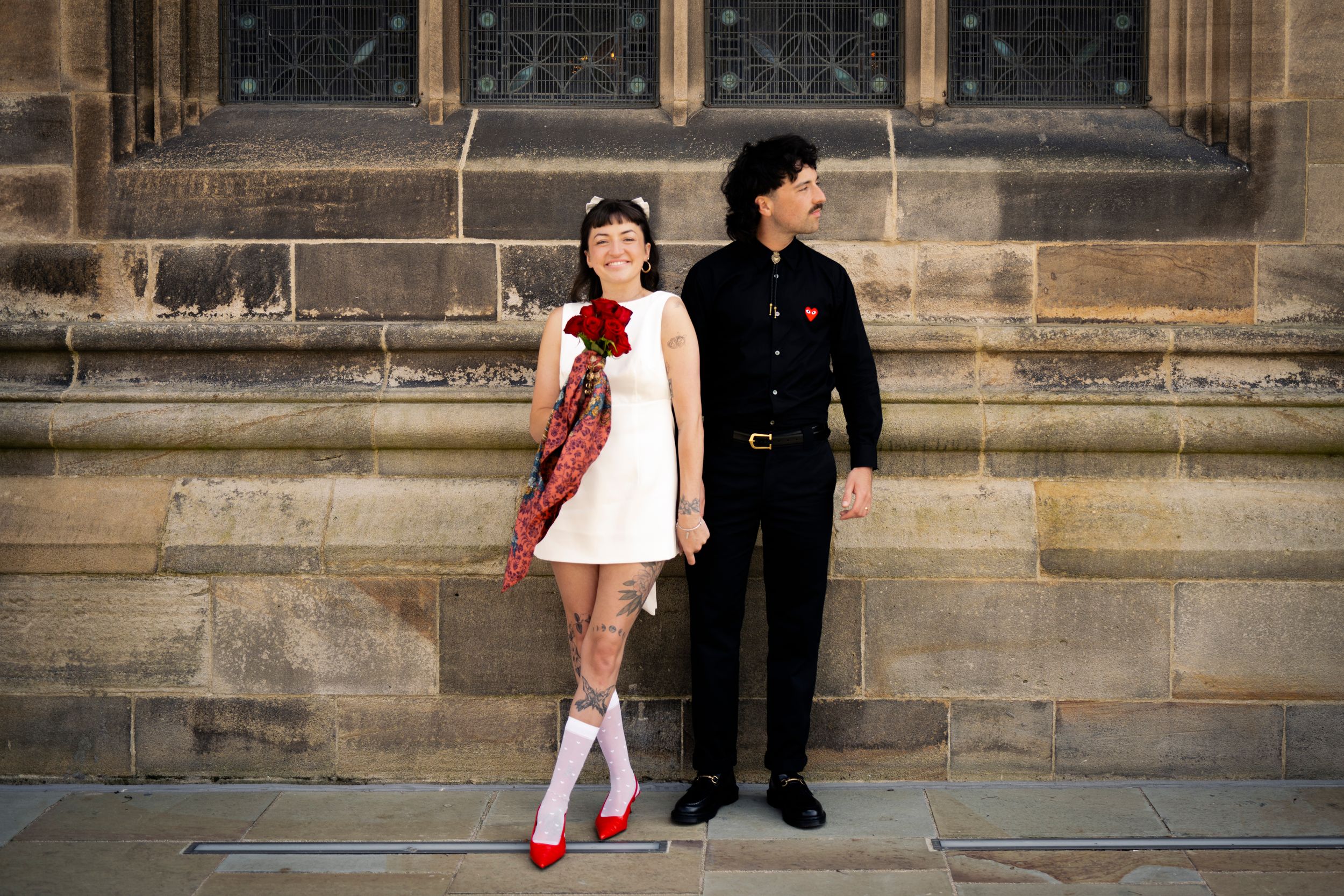 Tom and Grace, holding hands, with vintage fashion—capturing love, style, and heartfelt moments. Rochdale, Manchester Wedding