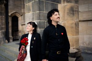 Tom and Grace, holding hands, with  vintage fashion—capturing love, style, and heartfelt moments. Rochdale, Manchester Wedding