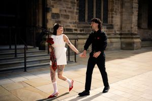 Tom and Grace, holding hands, with vintage fashion—capturing love, style, and heartfelt moments. Rochdale, Manchester Wedding