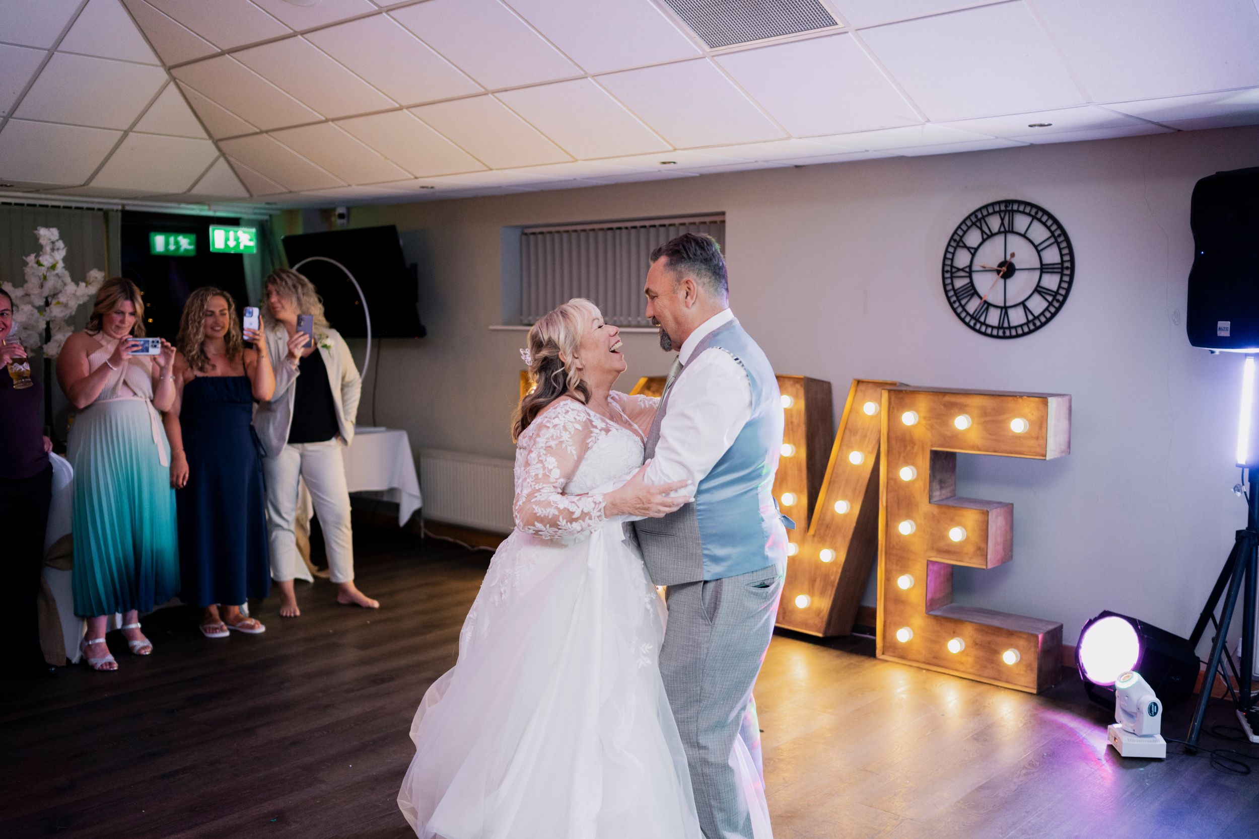 A candid, natural moment as the happy couple shares their first dance